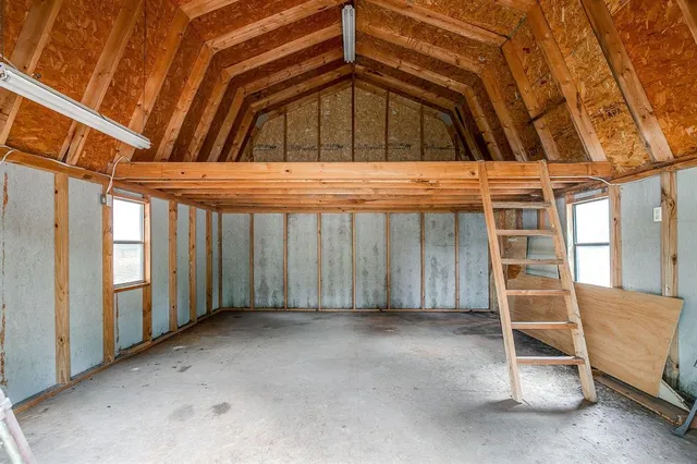 a view of open space with trees in the background