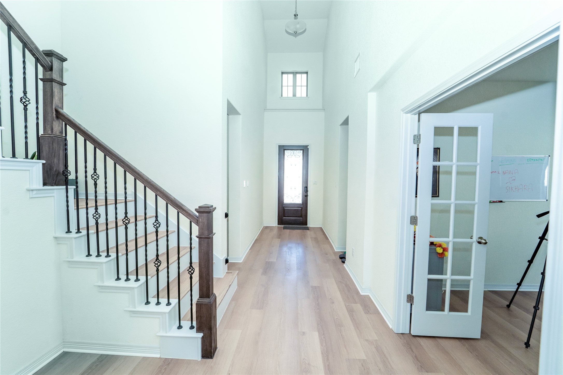 20813 Carries Ranch Road Pflugerville, TX 78660 - Photo 11 of 29 Entrance foyer featuring a high ceiling, plenty of natural light, and light wood-type flooring