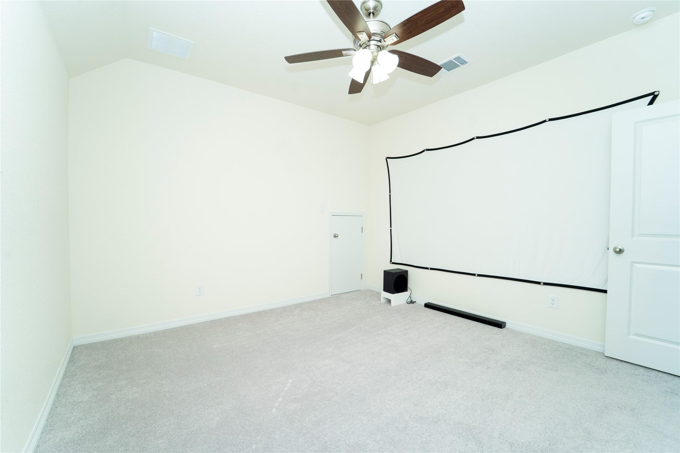 20813 Carries Ranch Road Pflugerville, TX 78660 - Photo 24 of 29 Carpeted home theater room with lofted ceiling and a ceiling fan
