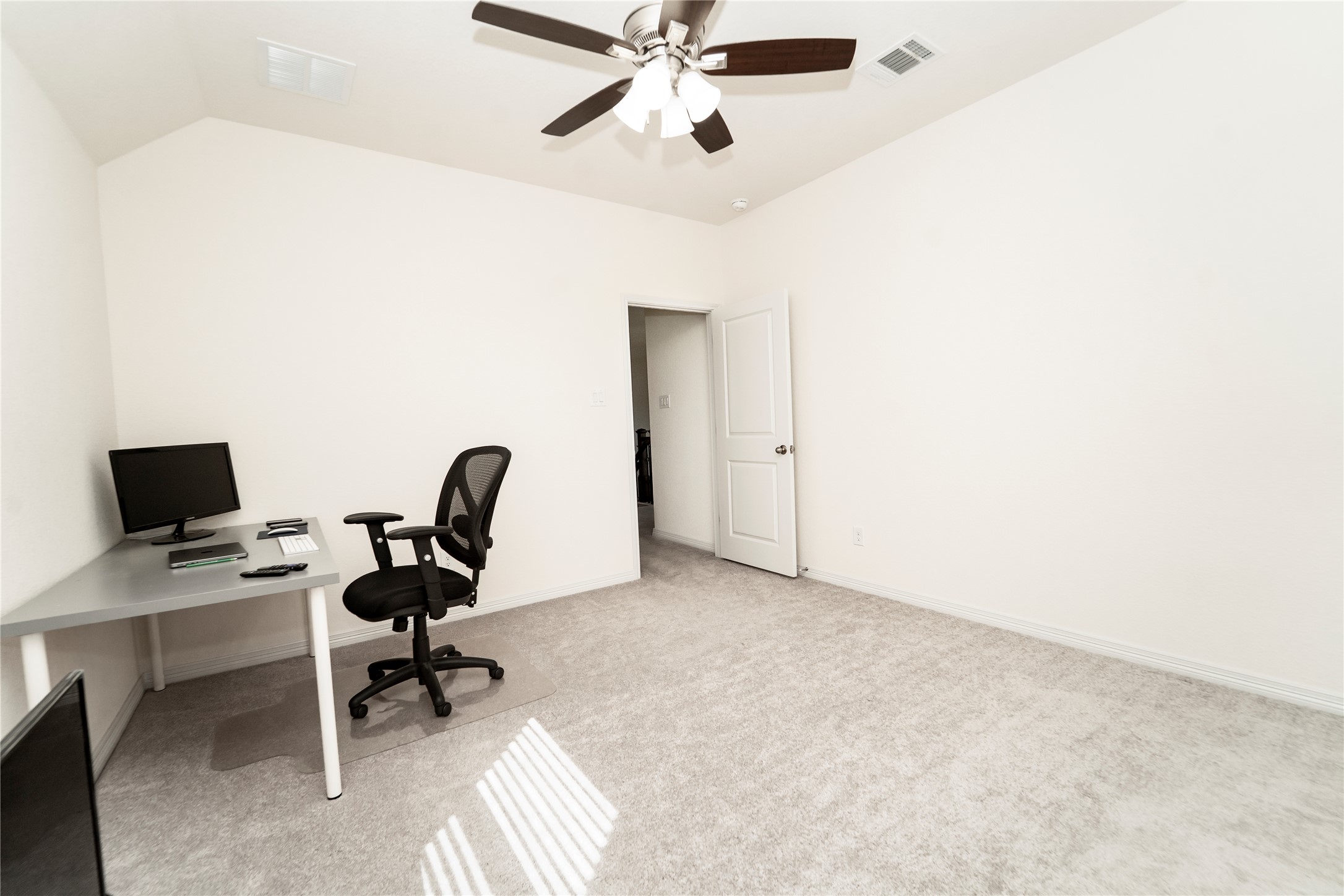 20813 Carries Ranch Road Pflugerville, TX 78660 - Photo 25 of 29 Office area with light carpet, vaulted ceiling, and a ceiling fan