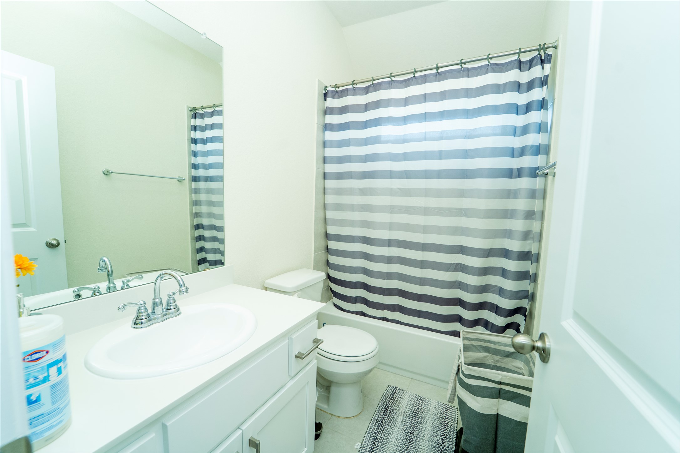 20813 Carries Ranch Road Pflugerville, TX 78660 - Photo 26 of 29 Bathroom featuring vanity, shower / tub combo, and light tile patterned flooring