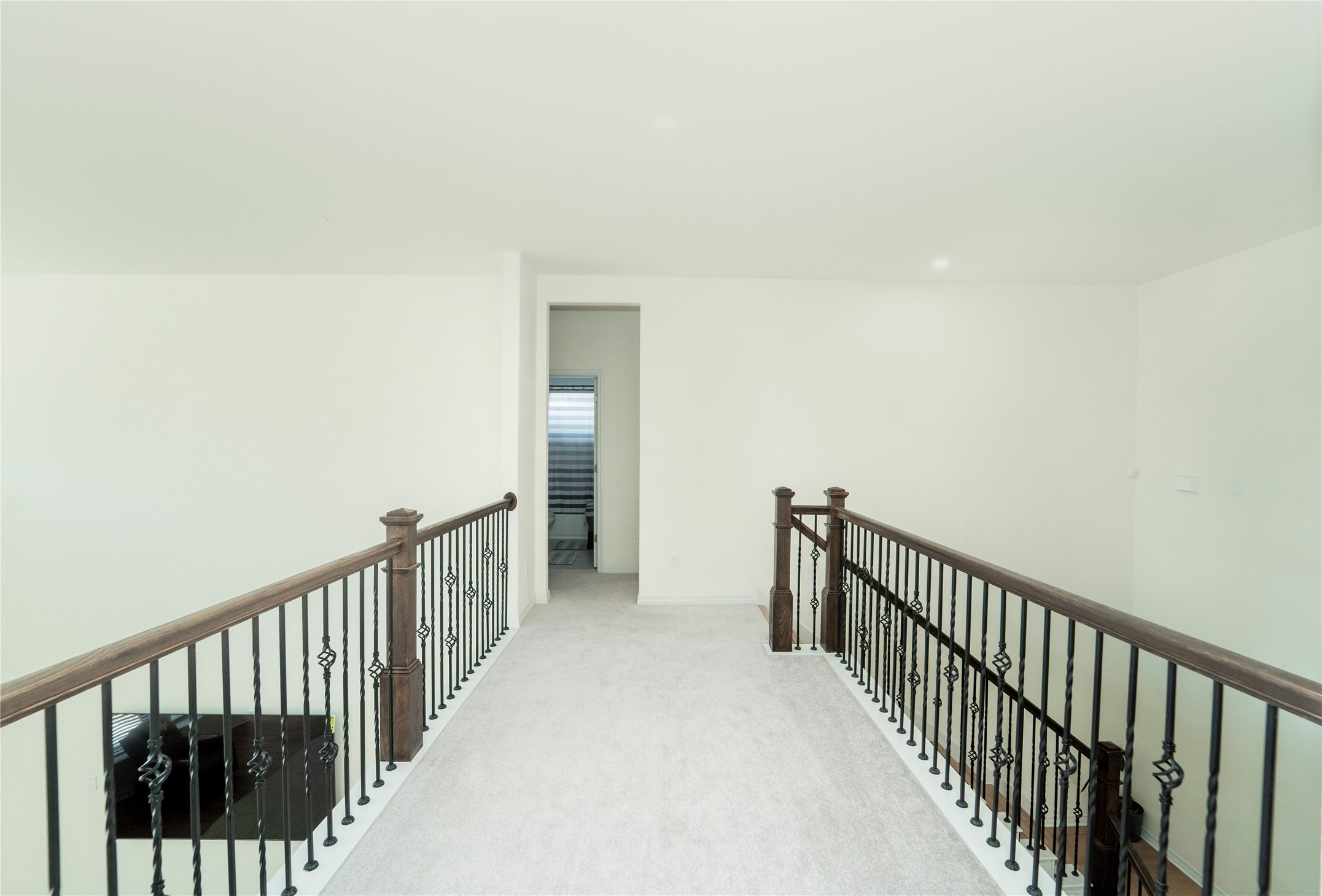 20813 Carries Ranch Road Pflugerville, TX 78660 - Photo 27 of 29 Hall with carpet floors and an upstairs landing