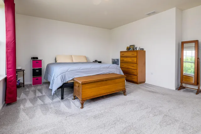 a bedroom with a bed and a closet