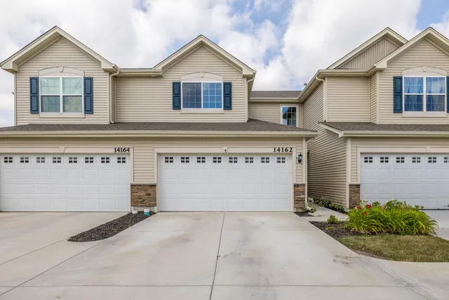 a view of a house with garage