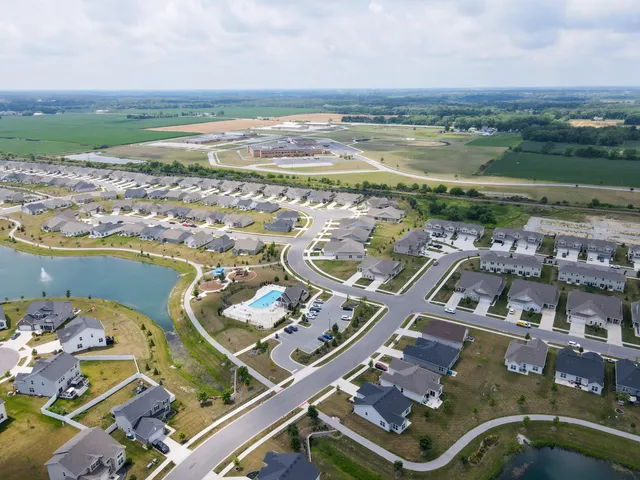 an aerial view of a city with ocean view