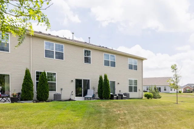 a view of a house with a yard and plants