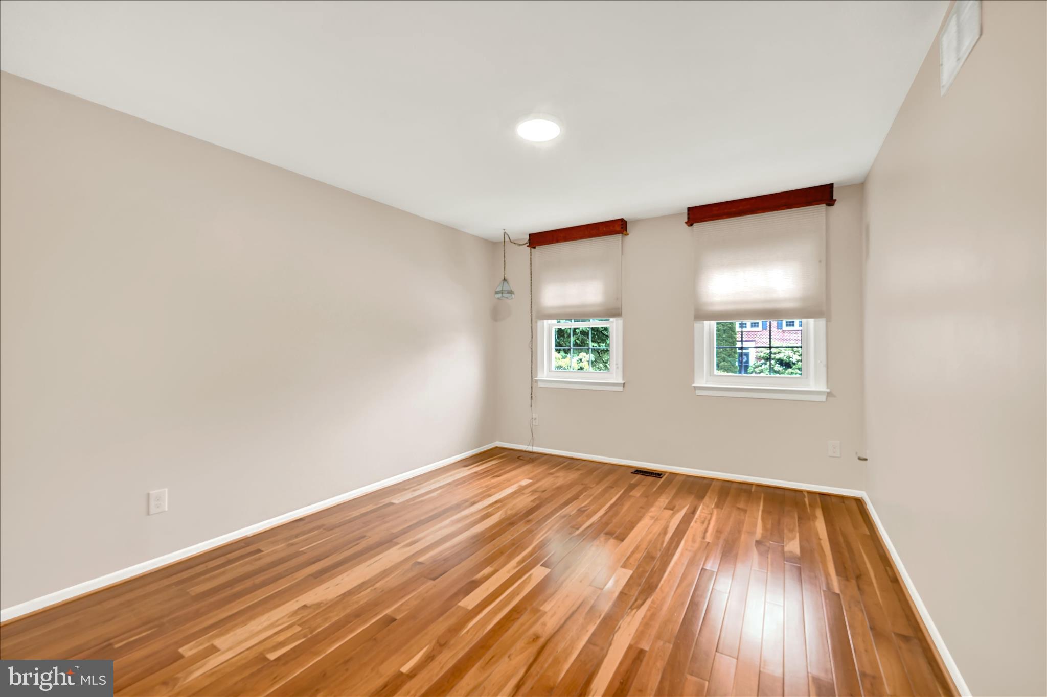 2317 Wonderview Road Lutherville-Timonium, MD 21093 - Photo 19 of 27 an empty room with wooden floor and windows