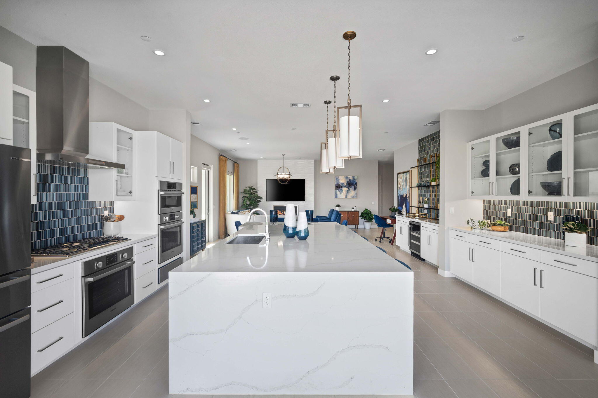 2 Iridium Way Rancho Mirage, CA 92270 - Photo 14 of 55 a large white kitchen with cabinets and stainless steel appliances