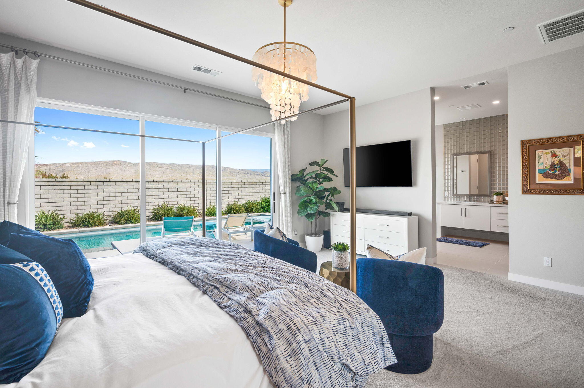 2 Iridium Way Rancho Mirage, CA 92270 - Photo 17 of 55 a spacious bedroom with a large window and a flat screen tv