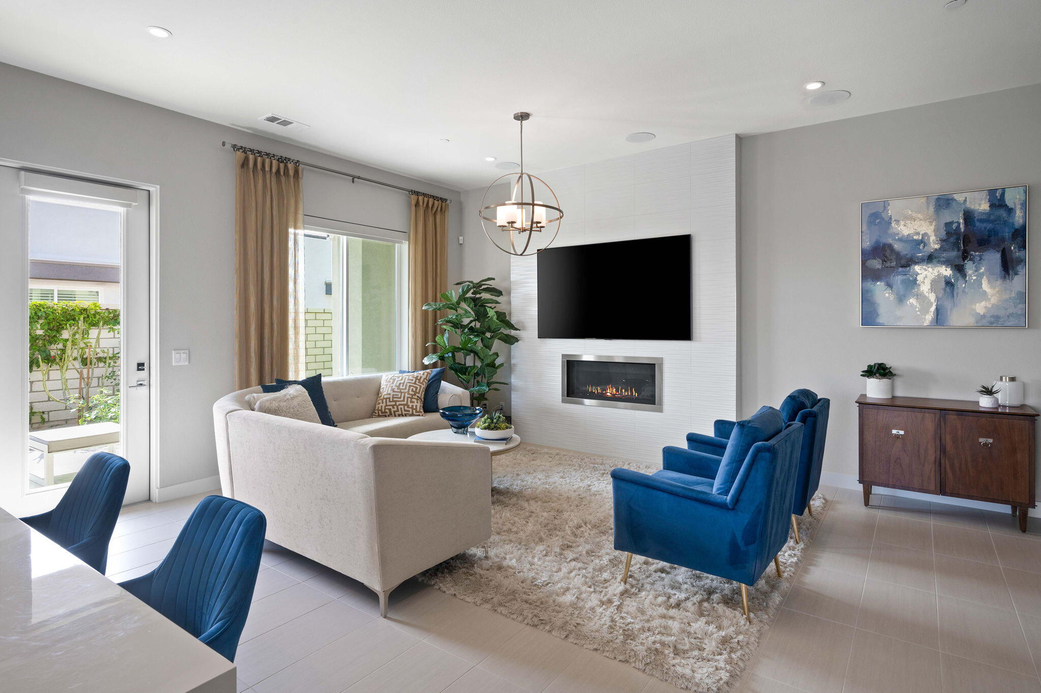 2 Iridium Way Rancho Mirage, CA 92270 - Photo 2 of 55 a living room with furniture a fireplace and a flat screen tv