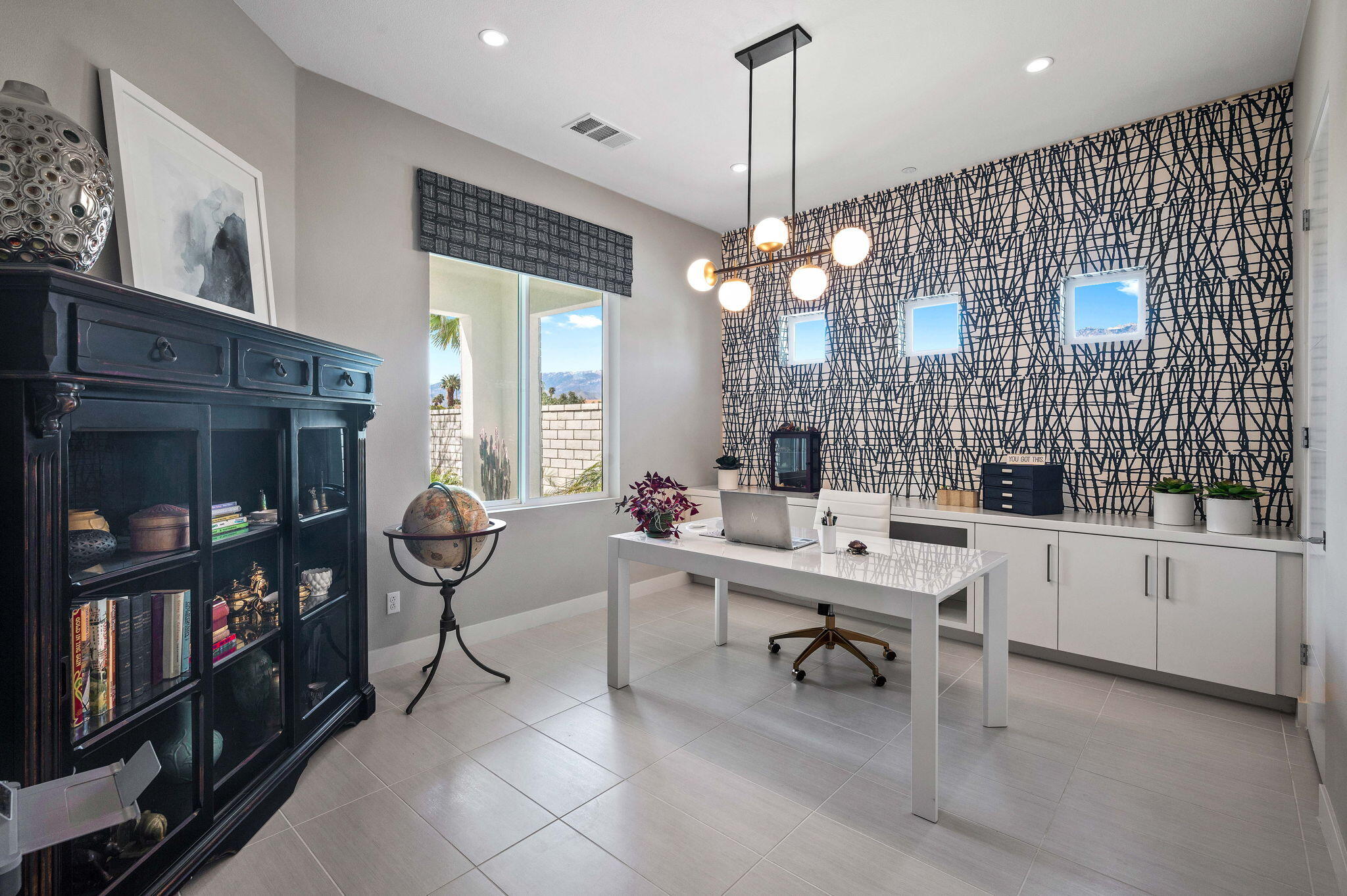 2 Iridium Way Rancho Mirage, CA 92270 - Photo 21 of 55 a room with lots of wooden furniture and a chandelier