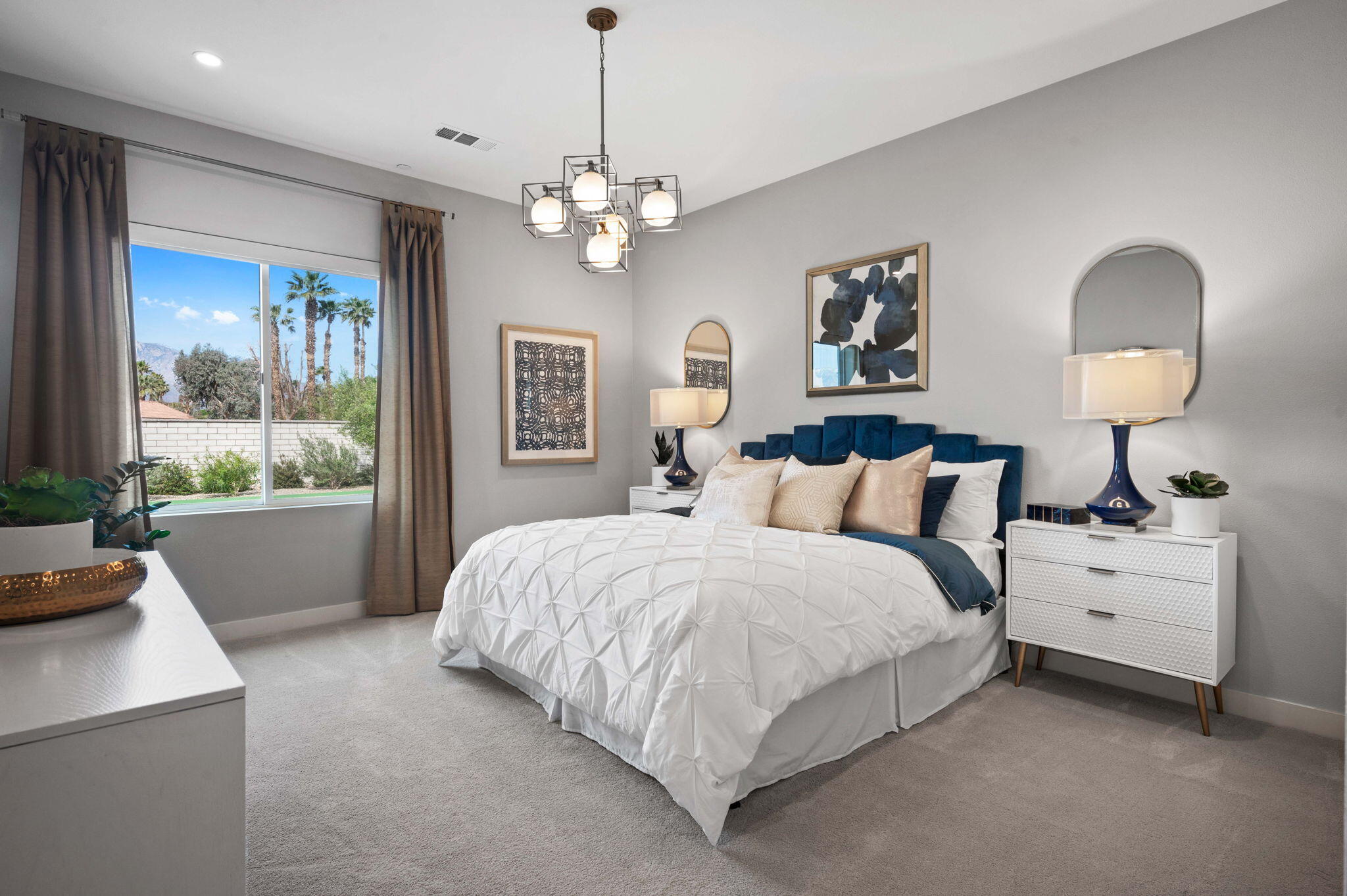 2 Iridium Way Rancho Mirage, CA 92270 - Photo 22 of 55 a spacious bedroom with bed and a large window