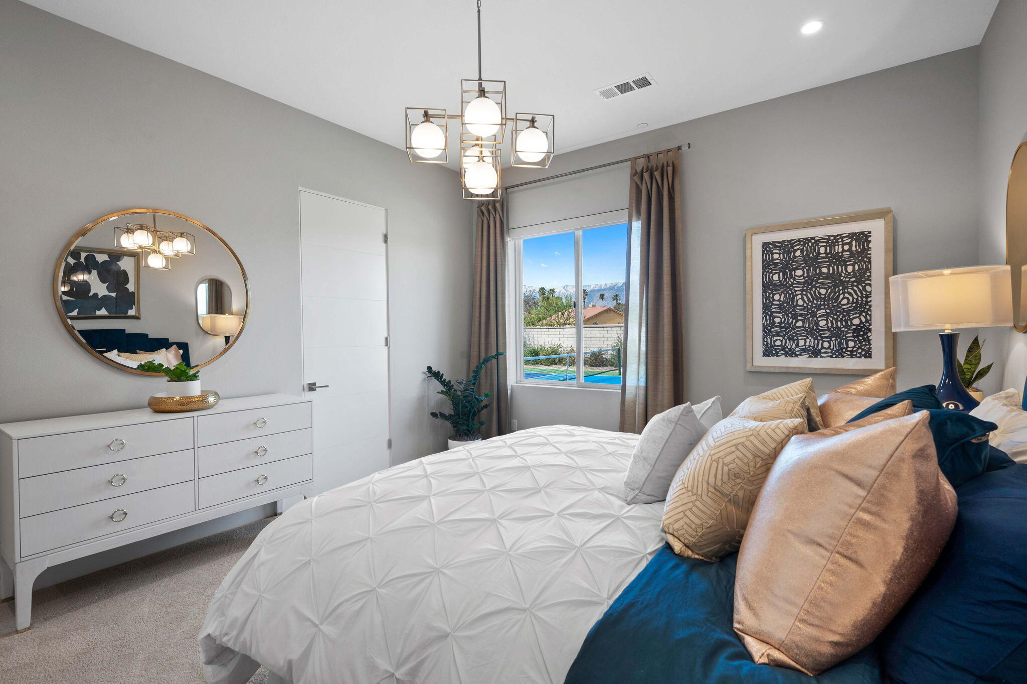 2 Iridium Way Rancho Mirage, CA 92270 - Photo 23 of 55 a bedroom with a large bed and a mirror