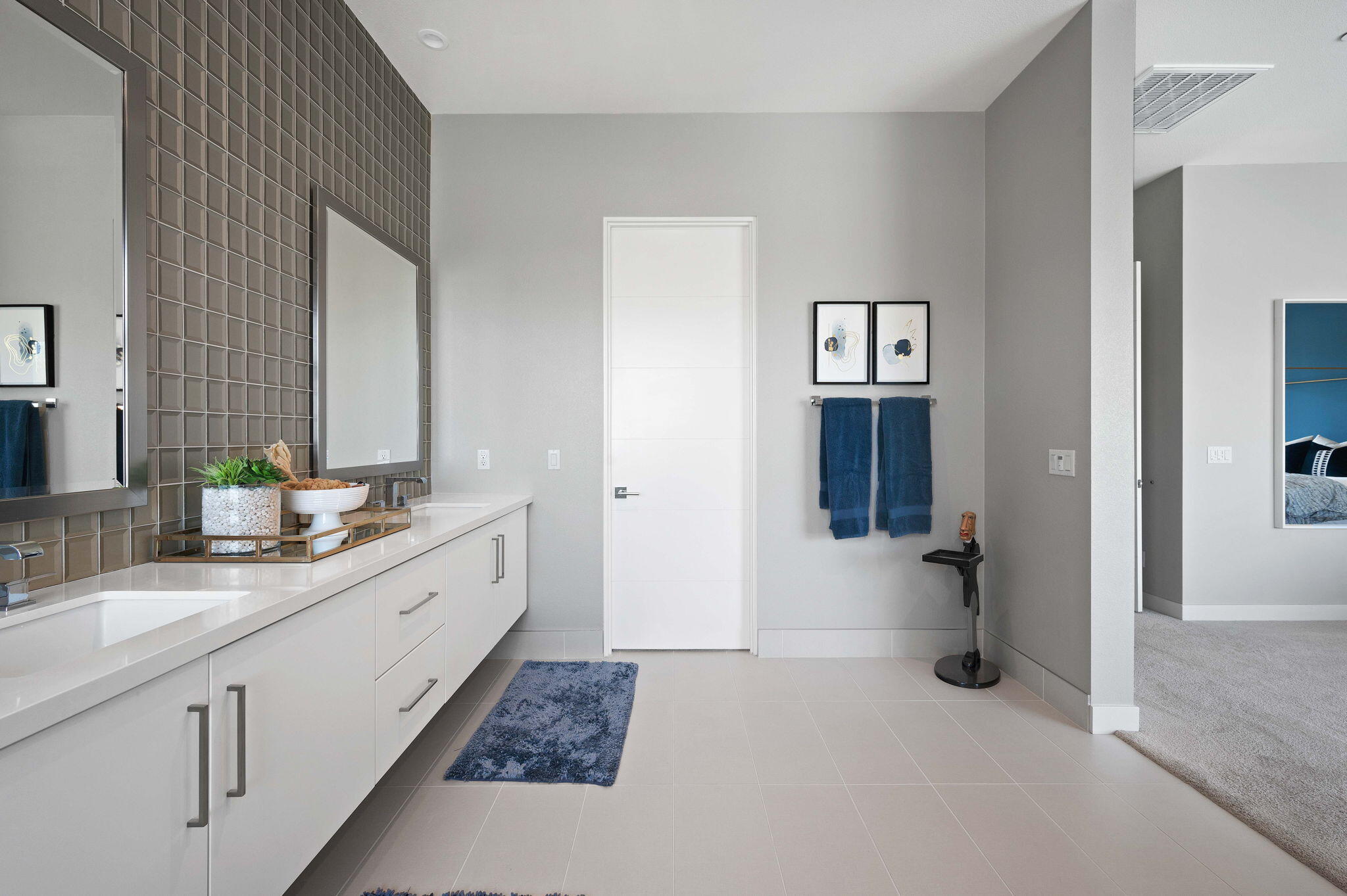 2 Iridium Way Rancho Mirage, CA 92270 - Photo 25 of 55 a spacious bathroom with double vanity a mirror and a shower