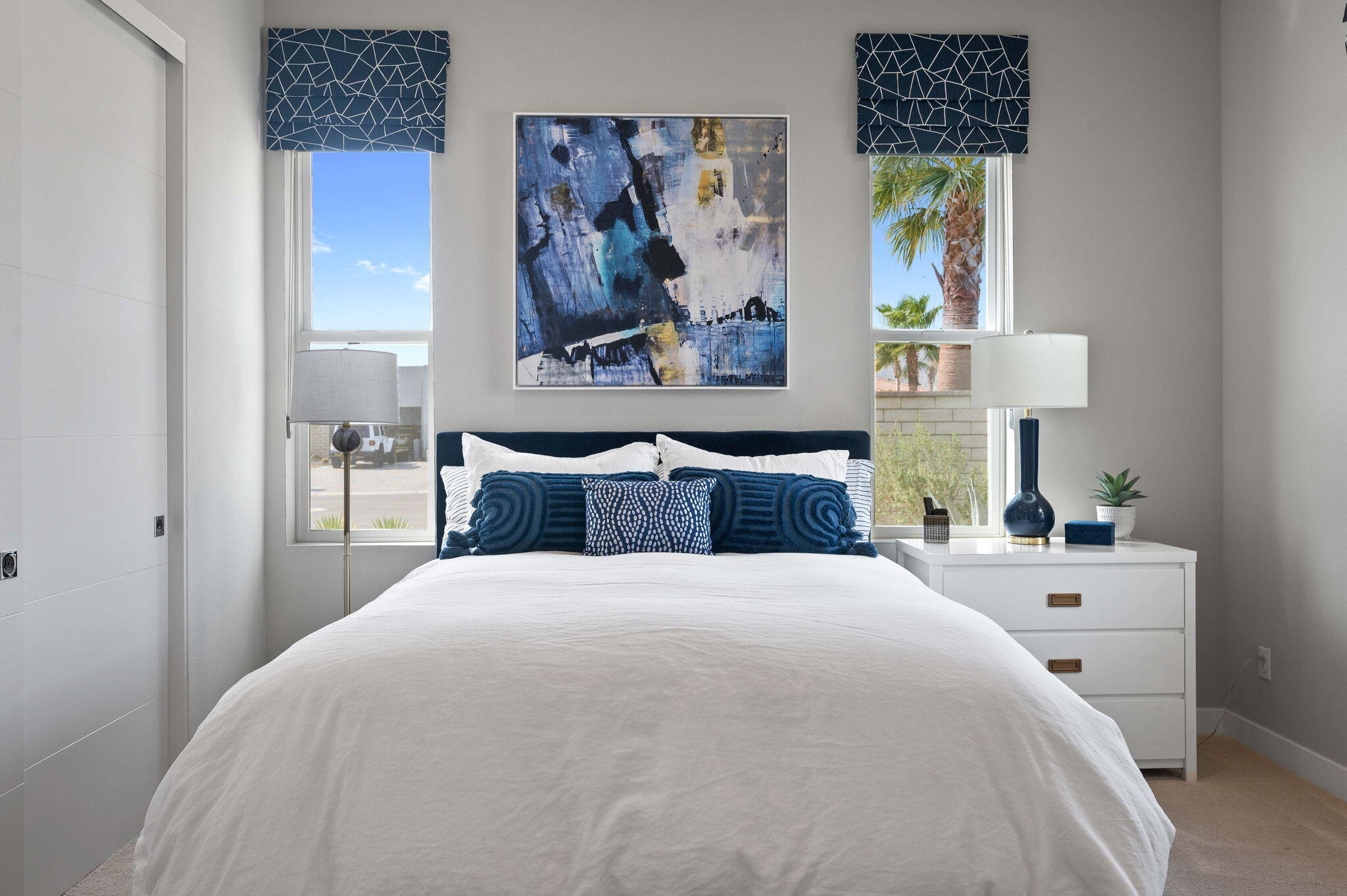 2 Iridium Way Rancho Mirage, CA 92270 - Photo 26 of 55 a bedroom with a bed and a painting on the wall