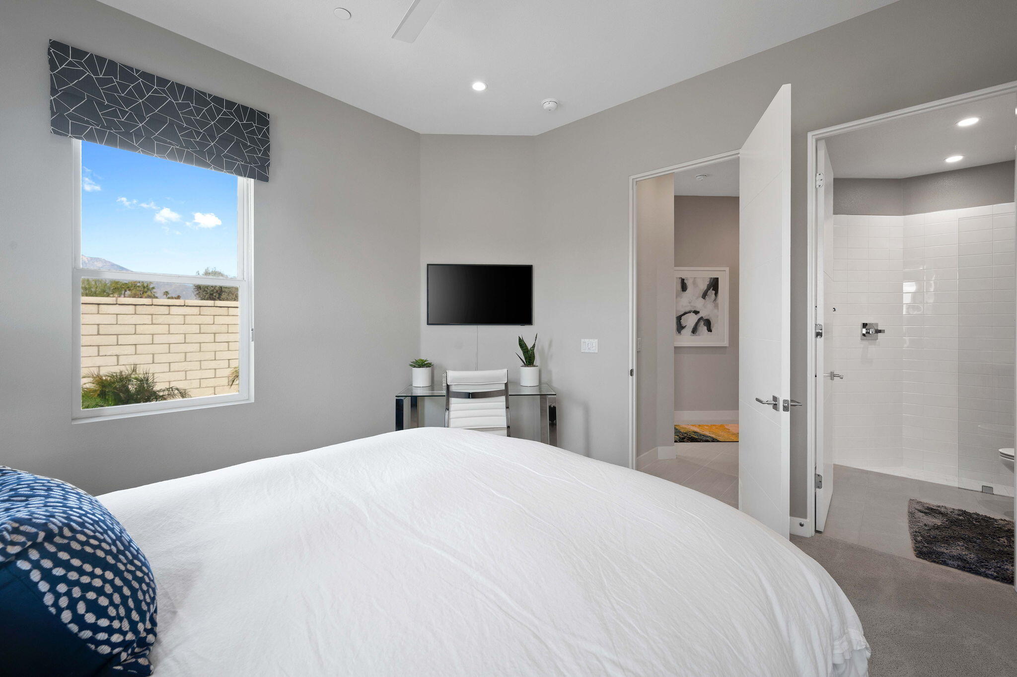 2 Iridium Way Rancho Mirage, CA 92270 - Photo 27 of 55 a bedroom with a bed and a flat tv screen on dresser