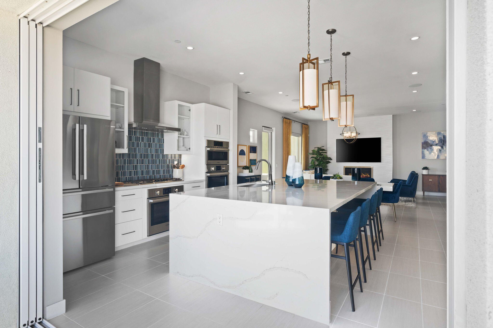 2 Iridium Way Rancho Mirage, CA 92270 - Photo 30 of 55 a large kitchen with stainless steel appliances kitchen island granite countertop a refrigerator and a stove top oven