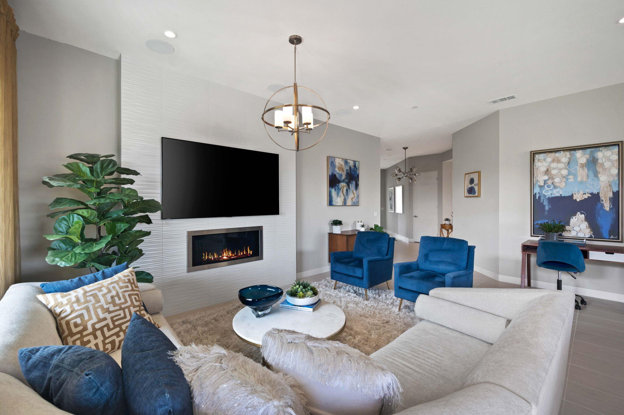 2 Iridium Way Rancho Mirage, CA 92270 - Photo 3 of 55 a living room with furniture a flat screen tv and a fireplace