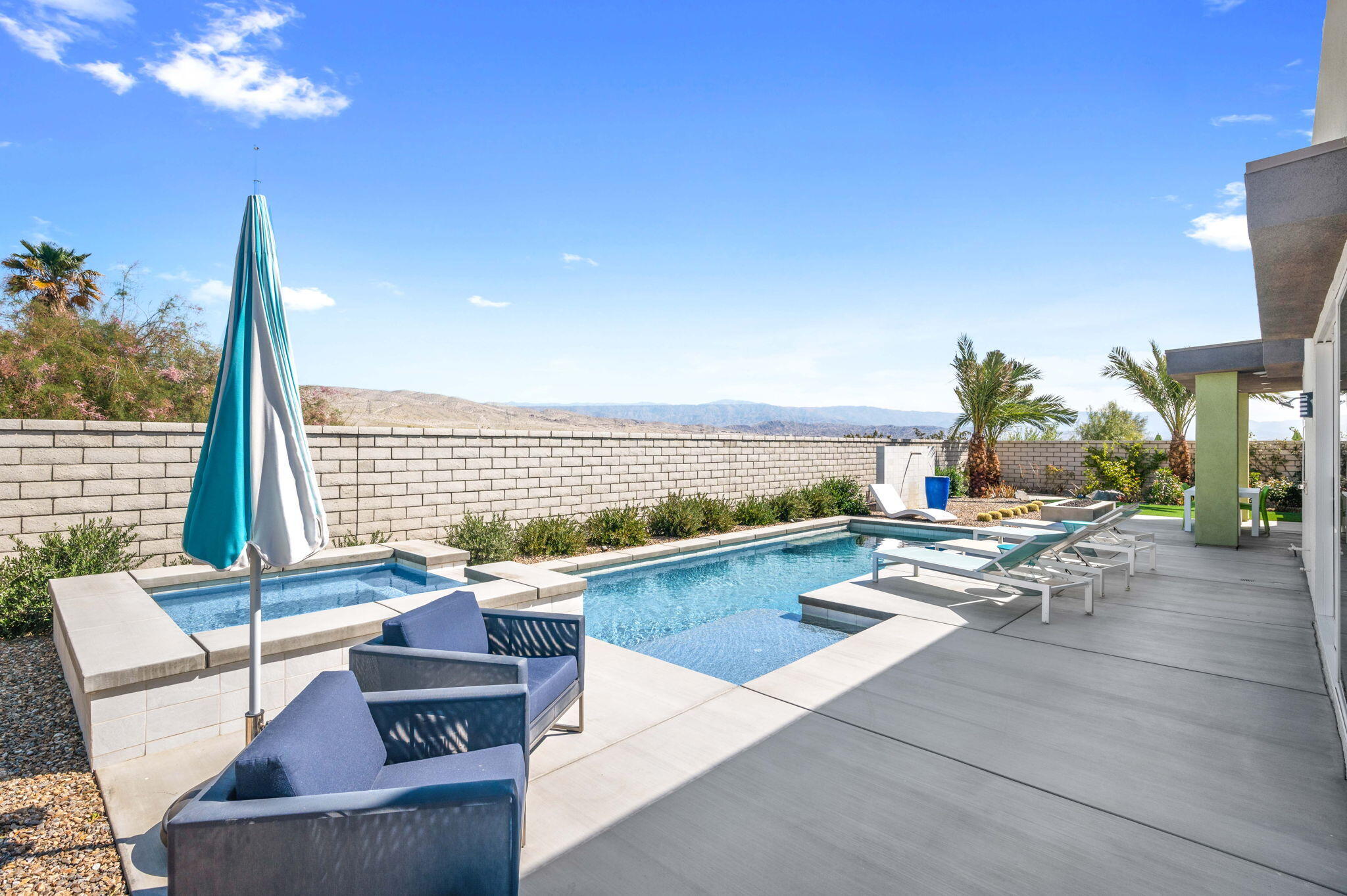 2 Iridium Way Rancho Mirage, CA 92270 - Photo 39 of 55 a living room with furniture and a large window