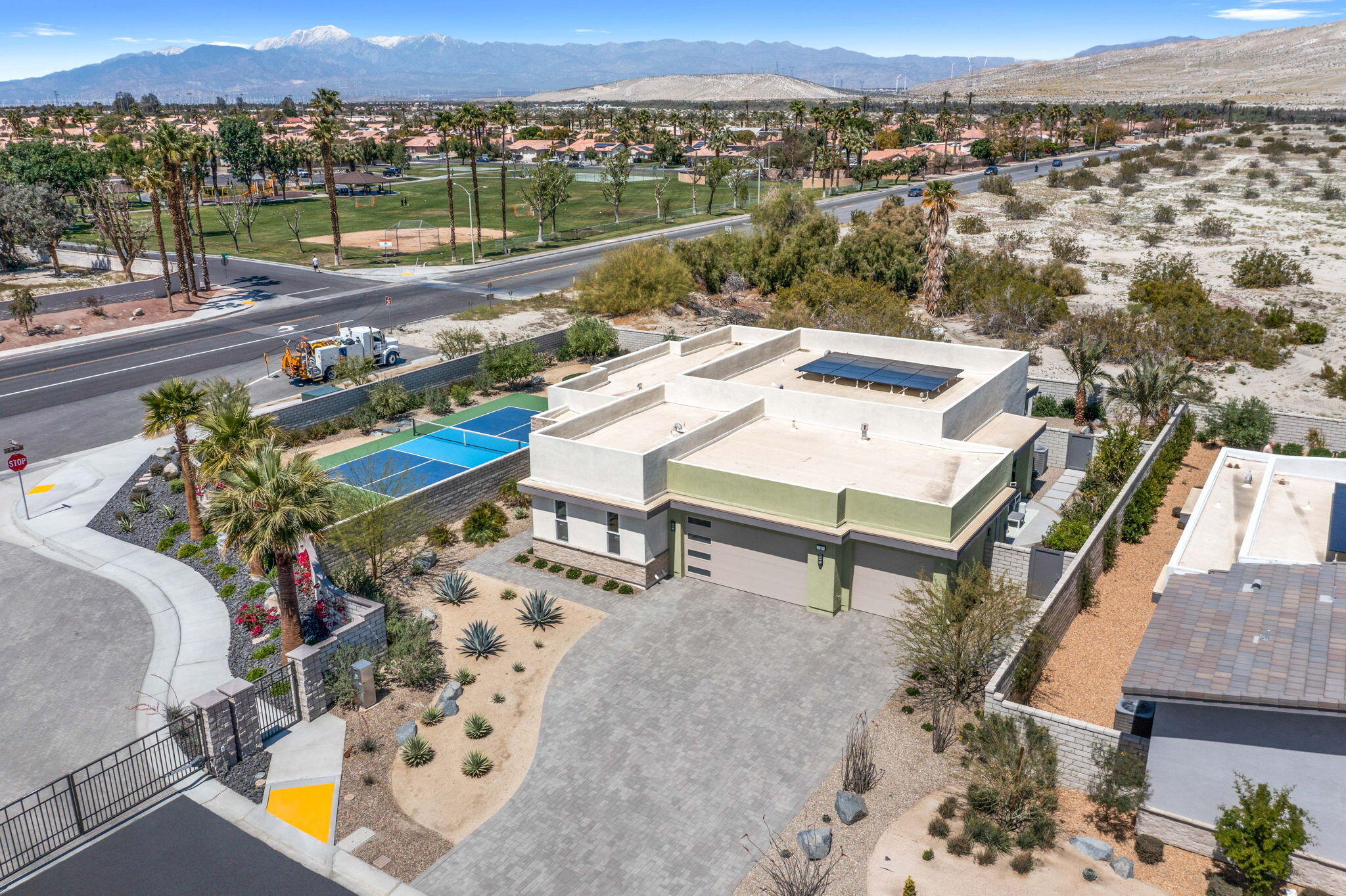 2 Iridium Way Rancho Mirage, CA 92270 - Photo 51 of 55 an aerial view of a house with a garden and lake view