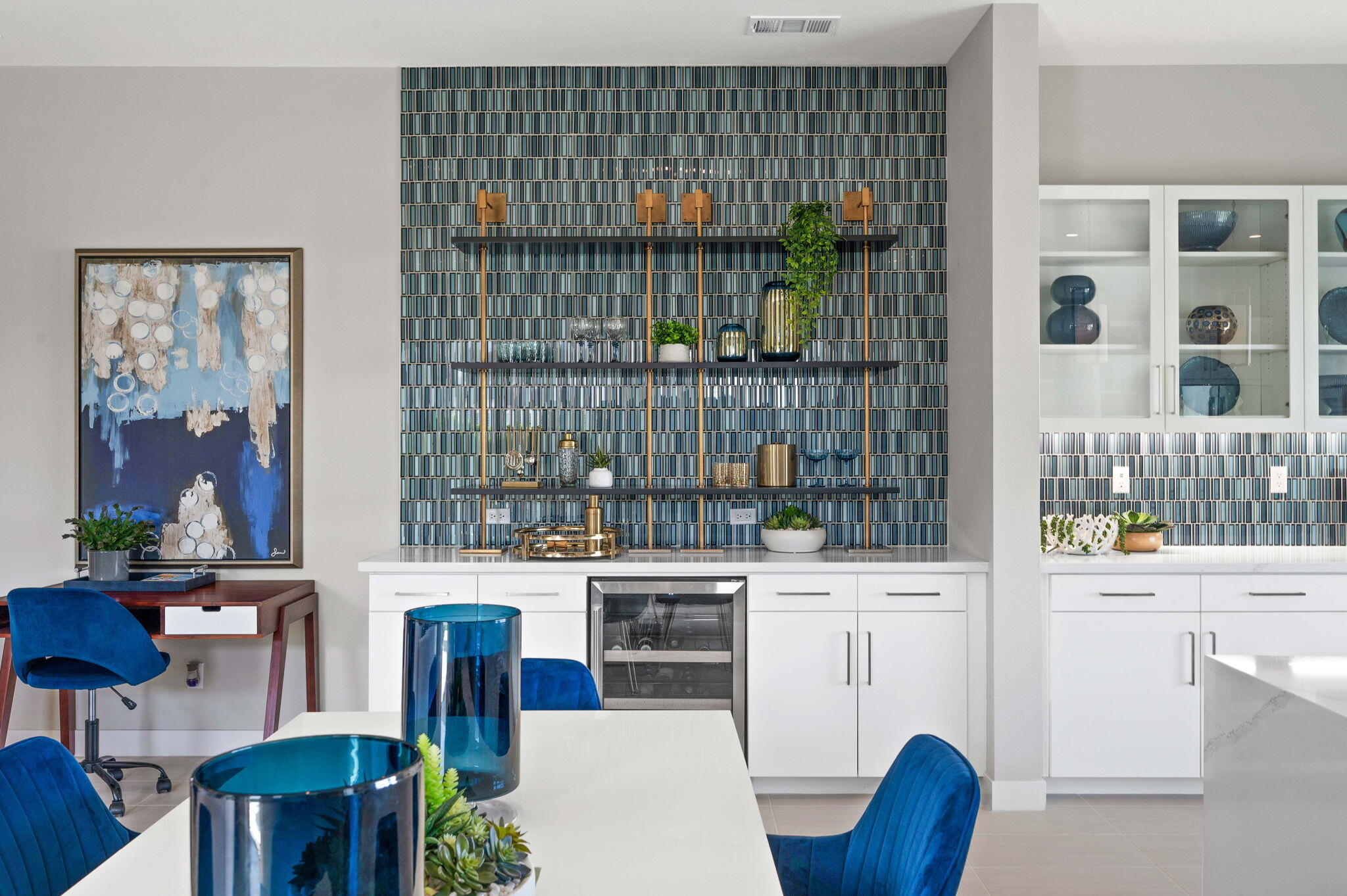 2 Iridium Way Rancho Mirage, CA 92270 - Photo 7 of 55 a kitchen with stainless steel appliances a stove a table and chair