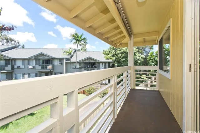 a view of balcony with furniture