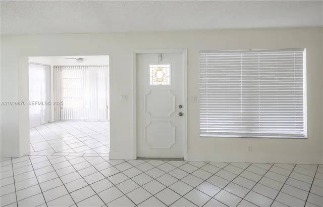 a view of a backyard with a lake view