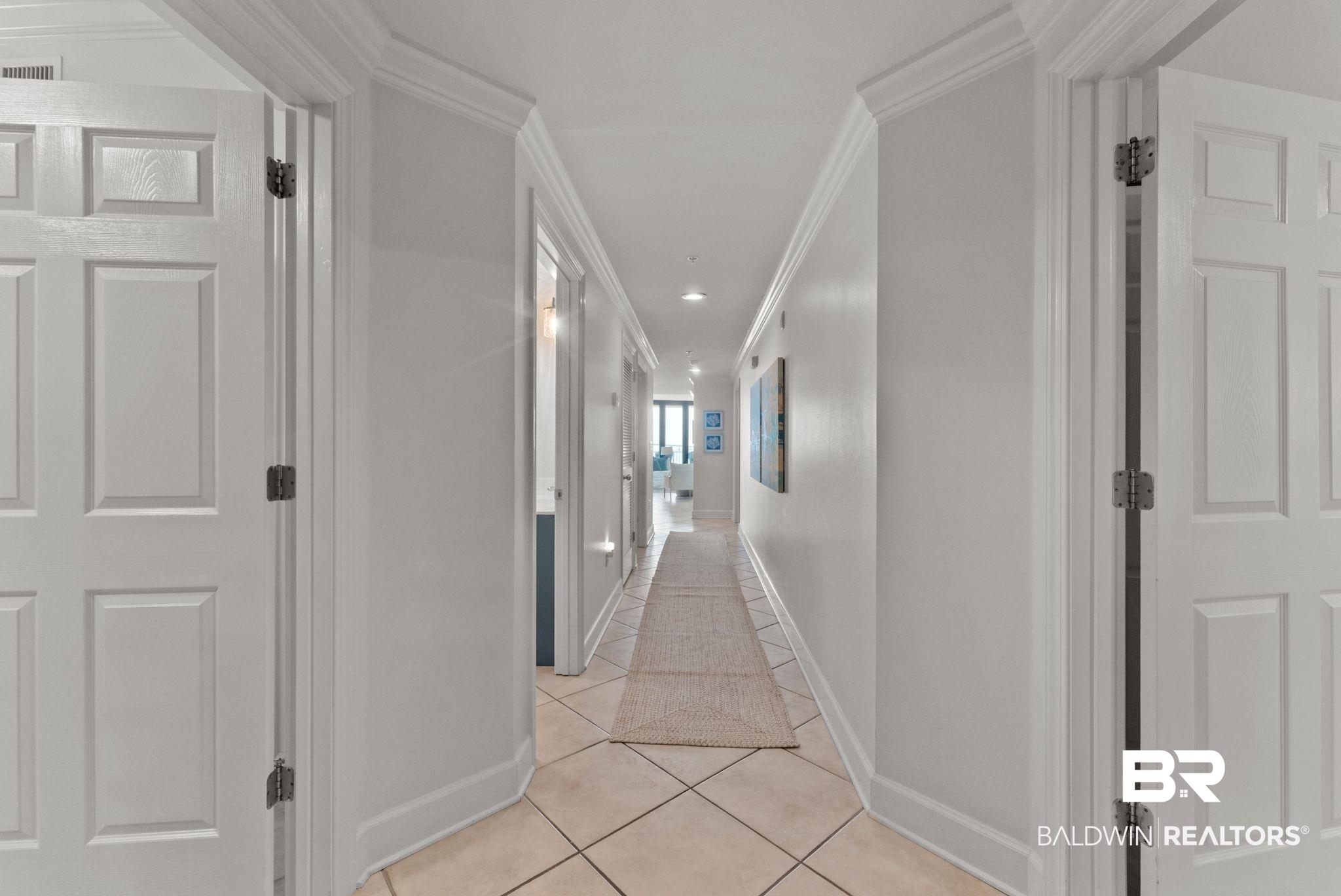 27580 Canal Road, Unit 1233 Orange Beach, AL 36561 - Photo 10 of 79 Hall with crown molding and light tile patterned floors