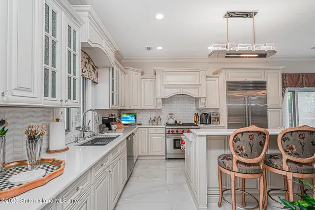 a living room with furniture and a fireplace with wooden floor