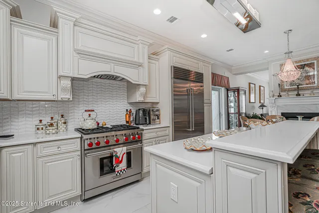 a living room with furniture or couch and a chandelier