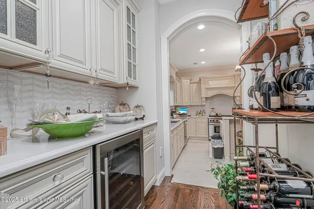 a living room with fireplace furniture and a large window