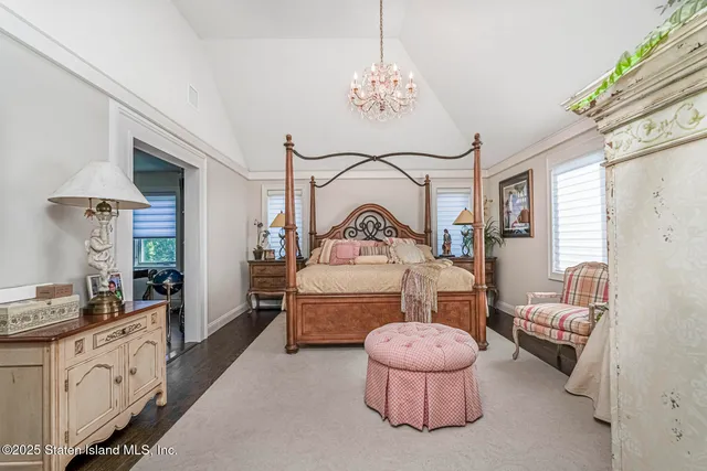 a bedroom with bed and a window