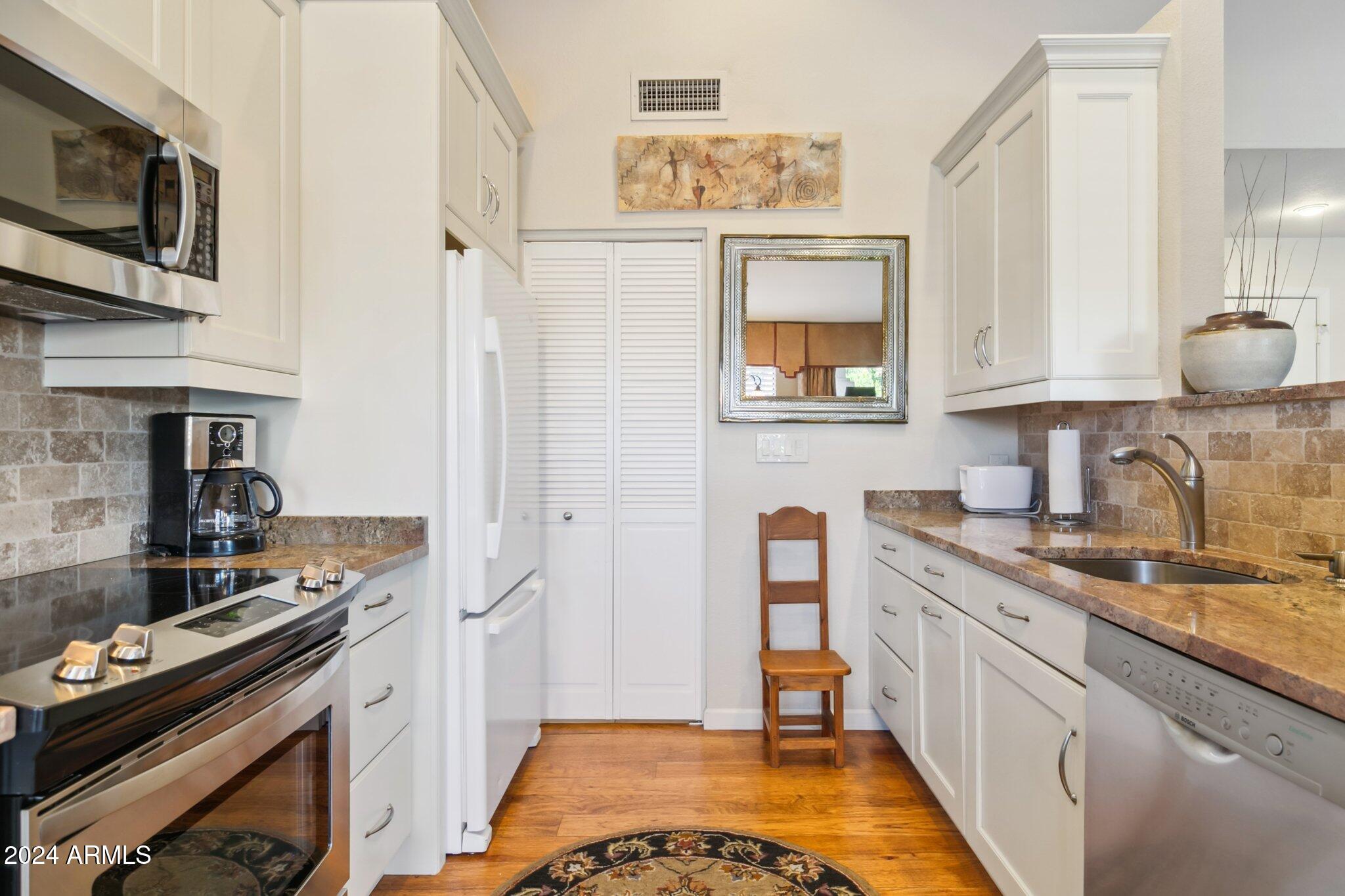 9707 East Mountain View Road, Unit 2438 Scottsdale, AZ 85258 - Photo 3 of 22 Laundry located off kitchen