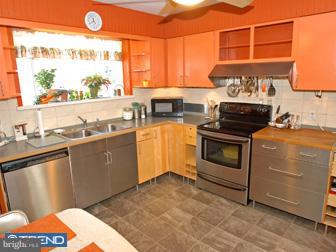 600 North Eagle Road Havertown, PA 19083 - Photo 4 of 6 a kitchen with stainless steel appliances a stove a sink and a window