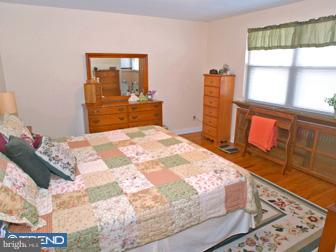 600 North Eagle Road Havertown, PA 19083 - Photo 5 of 6 a bedroom with a bed and wooden floor