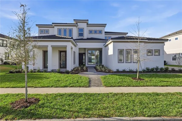 a front view of a house with a yard