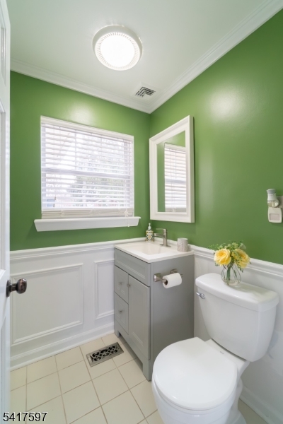 8 Dahlia Road Somerset, NJ 08873 - Photo 14 of 41 a bathroom with a sink a toilet a mirror a bathtub and next to a window