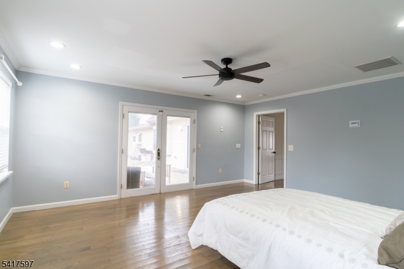 8 Dahlia Road Somerset, NJ 08873 - Photo 20 of 41 a bedroom with a large bed and a window