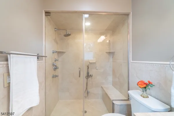 a bathroom with a shower and a sink