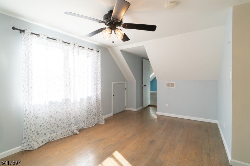 8 Dahlia Road Somerset, NJ 08873 - Photo 31 of 41 a view of a big room with wooden floor and windows in a room