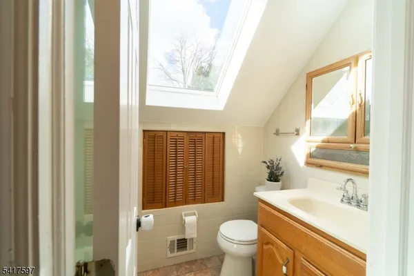 a bathroom with a sink toilet and tub