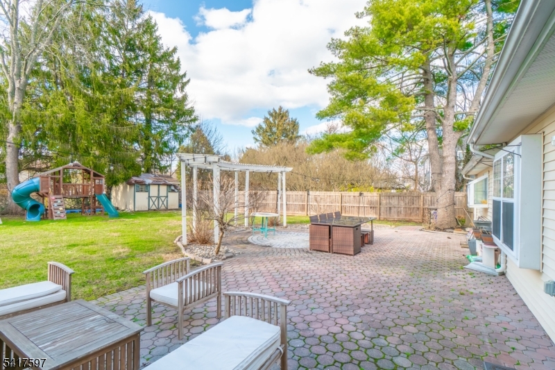 8 Dahlia Road Somerset, NJ 08873 - Photo 35 of 41 a view of a backyard with couches plants and large trees