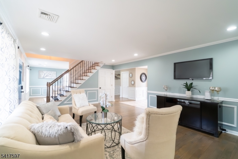 8 Dahlia Road Somerset, NJ 08873 - Photo 4 of 41 a living room with furniture kitchen view and a flat screen tv