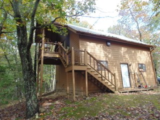 849 North Bluff Circle Monteagle, TN 37356 - Photo 16 of 17 a view of a house with a yard