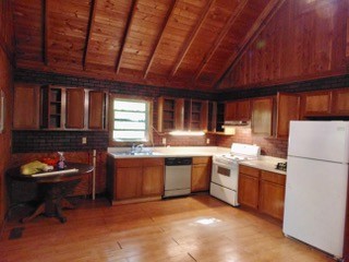 849 North Bluff Circle Monteagle, TN 37356 - Photo 7 of 17 a kitchen with refrigerator and chairs