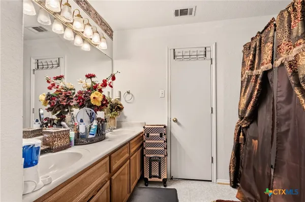 a view of living room with furniture and flowers
