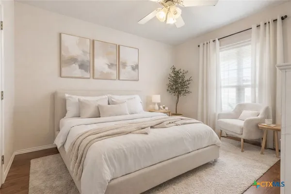 a bedroom with bed and a window