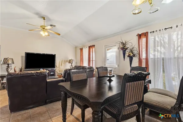 a view of a livingroom with furniture and a flat screen tv