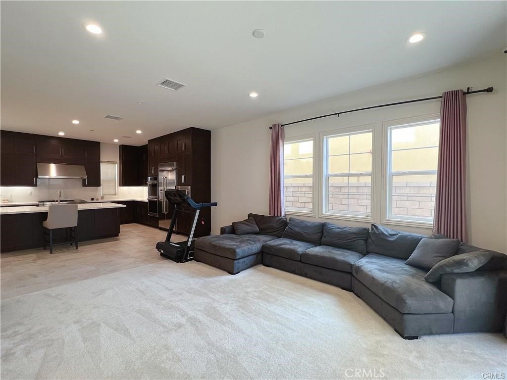 185 Bryce Run Lake Forest, CA 92630 - Photo 15 of 34 a living room with furniture and a large window