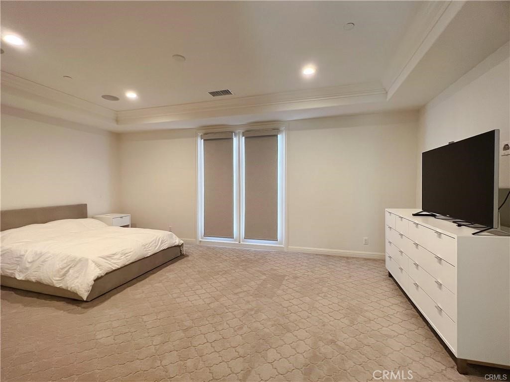 185 Bryce Run Lake Forest, CA 92630 - Photo 17 of 34 a bedroom with a bed and flat screen tv